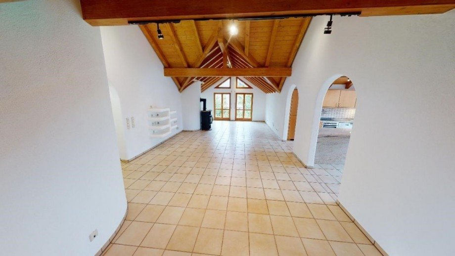 Wohnzimmer mit Kaminofen Dachgeschosswohnung K�ssaberg